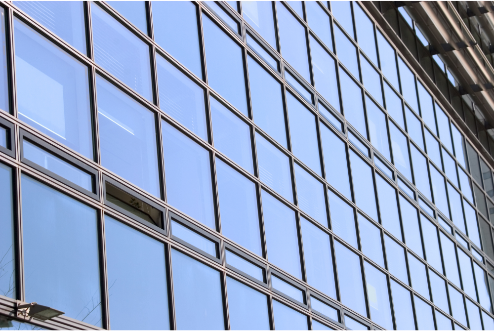 commercial glass building, glass repair, glass scratch removal services